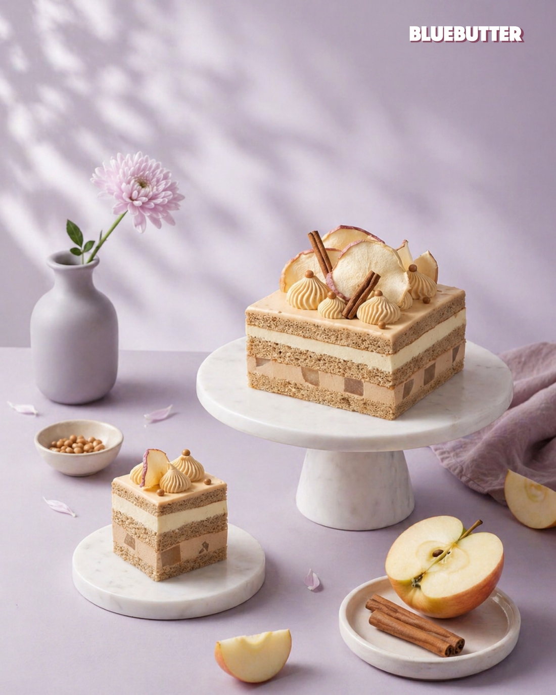 Apple Earl Grey layer cake with caramel whipped ganache, apple mousse, Earl Grey crémeux and soft poached apple on a marble cake stand.