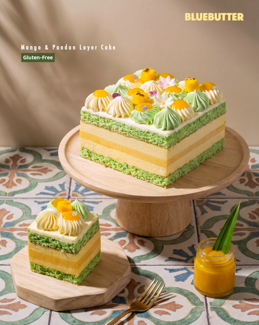 BLUEBUTTER Mango and Pandan Layer Cake with fresh mango, pandan cream and a plated cake slice.