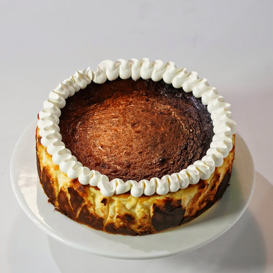 A premium gluten-free Classic Vanilla Basque Cheesecake with a perfectly caramelised burnt top, handcrafted by BLUEBUTTER Patisserie in Perth.