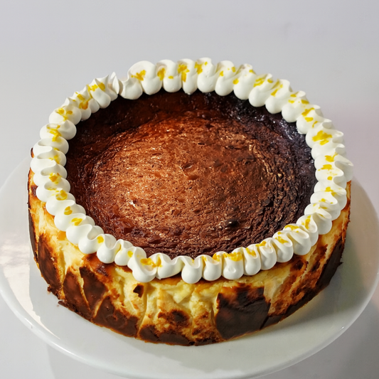 A premium gluten-free D24 Durian Basque Cheesecake with a beautifully caramelised top, handcrafted by BLUEBUTTER Patisserie in Perth.