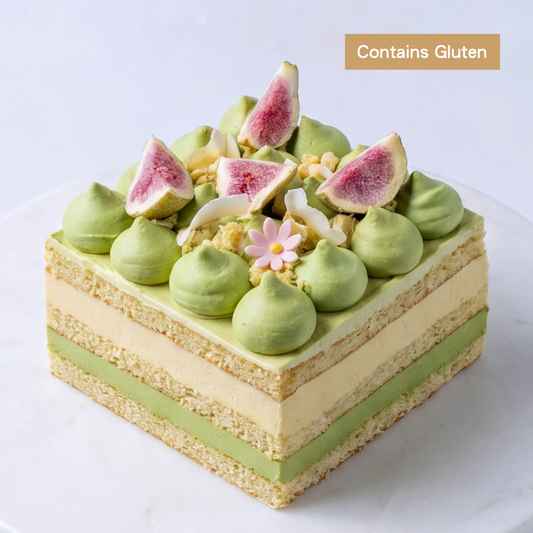 A diagram of the Durian and Pandan Layer Cheesecake showing a massive 200g D24 durian core, pandan cream cheese mousse, and coconut sponge, by BLUEBUTTER in Perth.