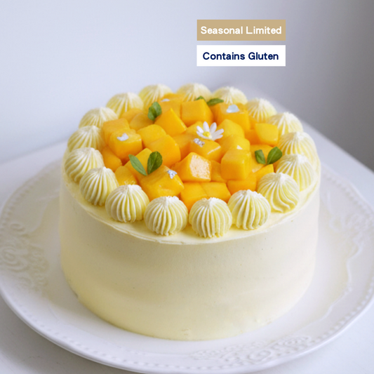 A premium seasonal Mango Shortcake generously topped with fresh juicy mango cubes and light cream, handcrafted by BLUEBUTTER Patisserie in Perth.