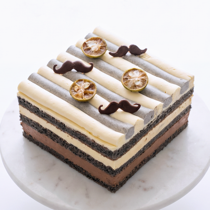 BLUEBUTTER Lemon and Dark Chocolate Layer Cake with black sesame sponge, lemon cream and chocolate mousse.