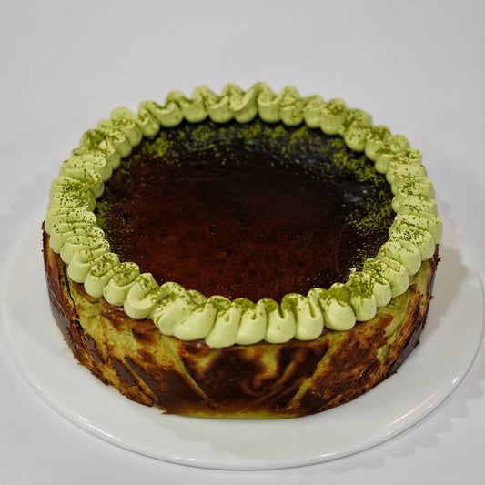 A premium gluten-free Matcha Basque Cheesecake with a beautifully caramelised burnt top, handcrafted by BLUEBUTTER Patisserie in Perth.
