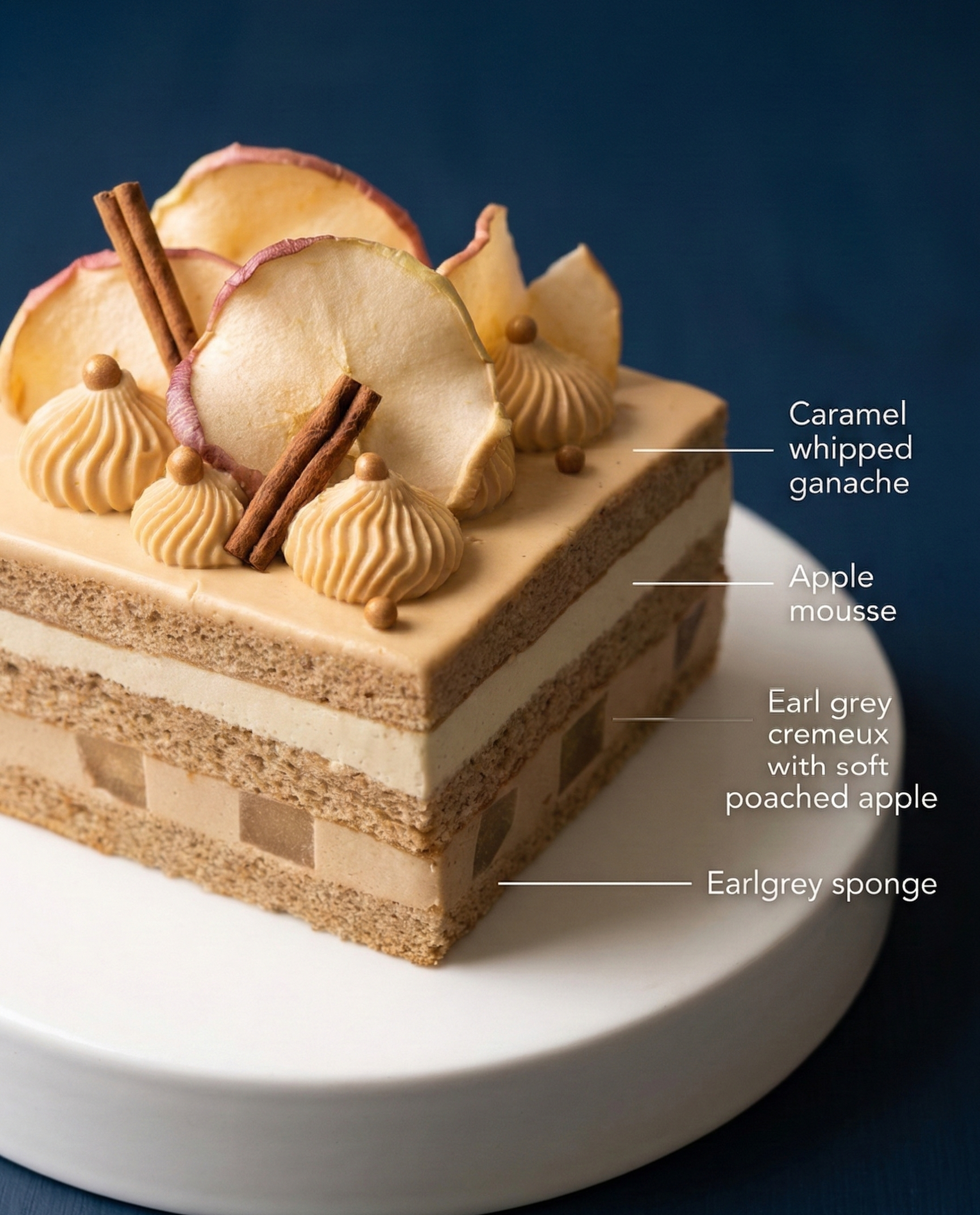 Cross-section of an elegant layer cake showing Earl Grey sponge, vanilla-poached apples, and caramel whipped ganache.