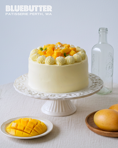 Cross-section of a fluffy Mango Shortcake showing layers of soft sponge and silky mango cream.