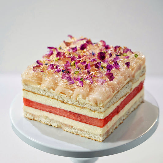 BLUEBUTTER Watermelon & Lychee Layer Cake with fresh watermelon, lychee rose cream and crushed pistachios.
