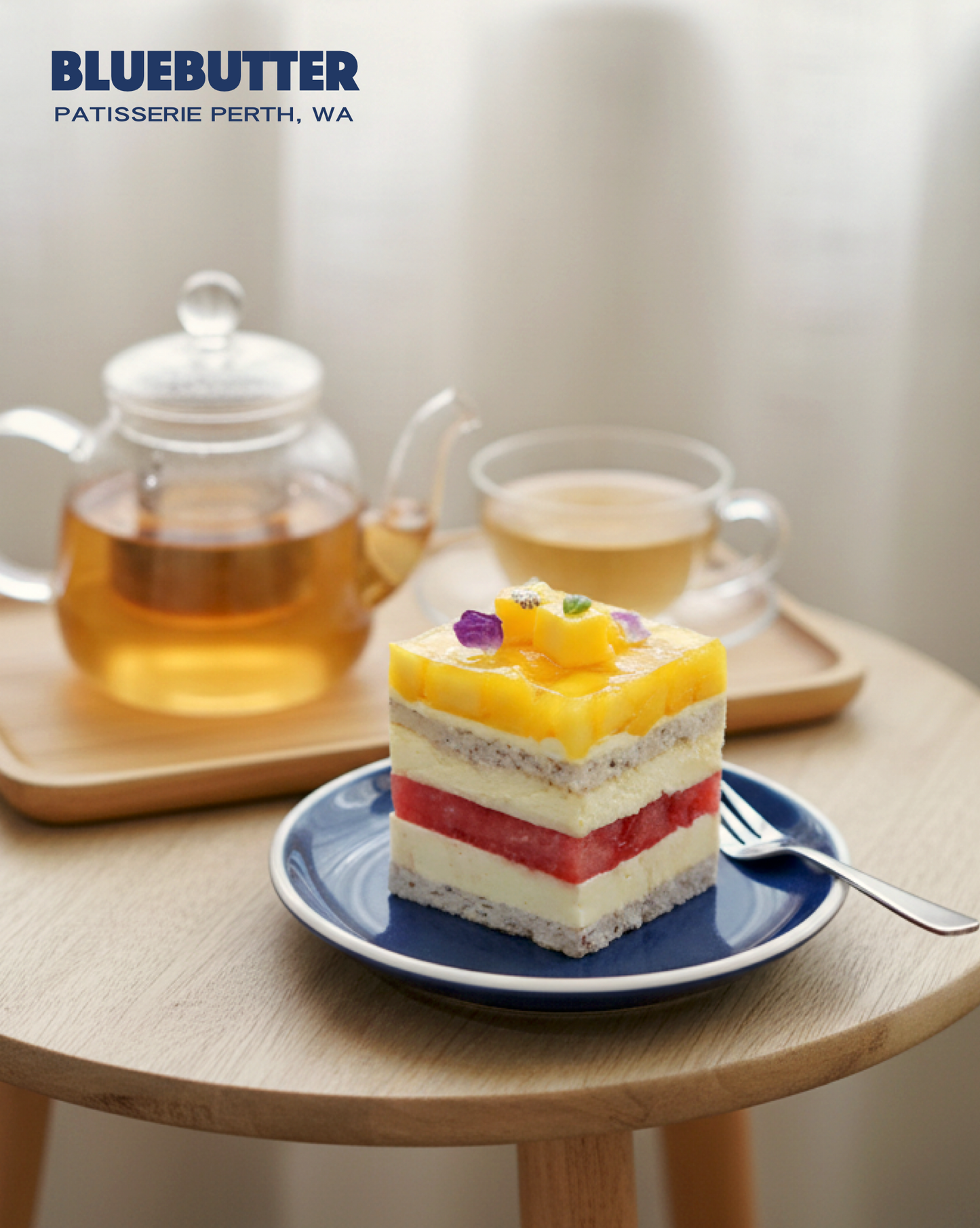 Watermelon and mango layer cake with orange cream, fresh watermelon, seasonal mango and almond hazelnut base by BLUEBUTTER Perth